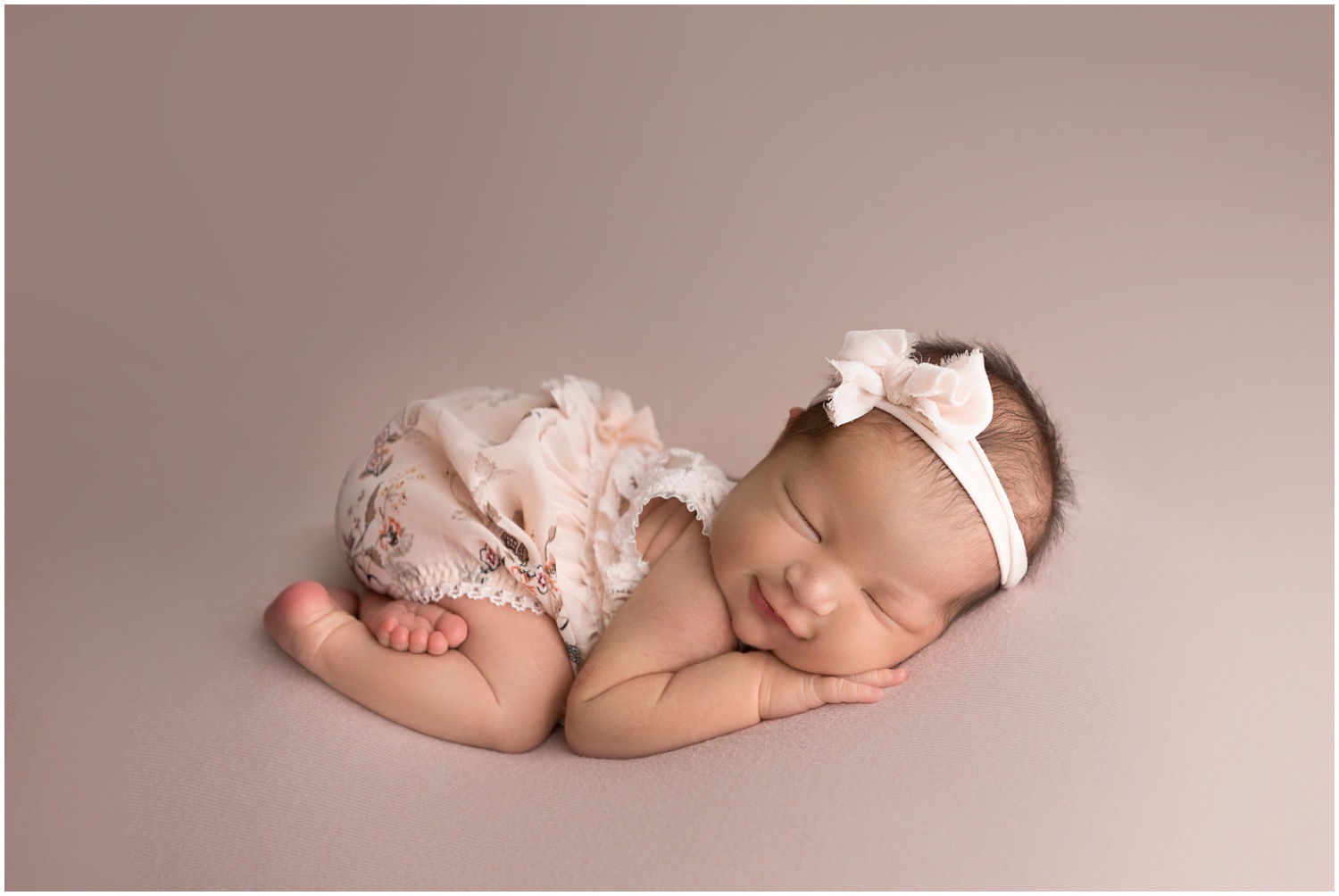 columbus ohio newborn session baby girl in blush and florals smiling